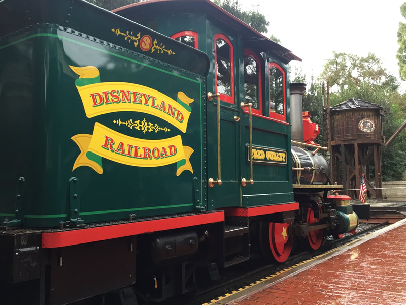 Side of Green Tank Engine. "Disneyland Railroad 3" is written on the bunker. 