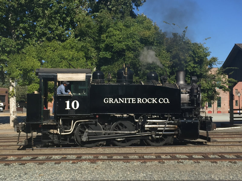 Side view of an 0-6-OT Steam locomotive. "Granite Rock Co."and "10 are written on the locomotive. 